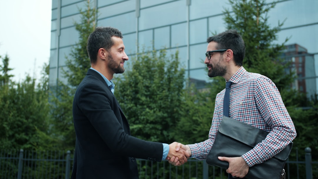 FoxSecur representative shaking hands with a business client