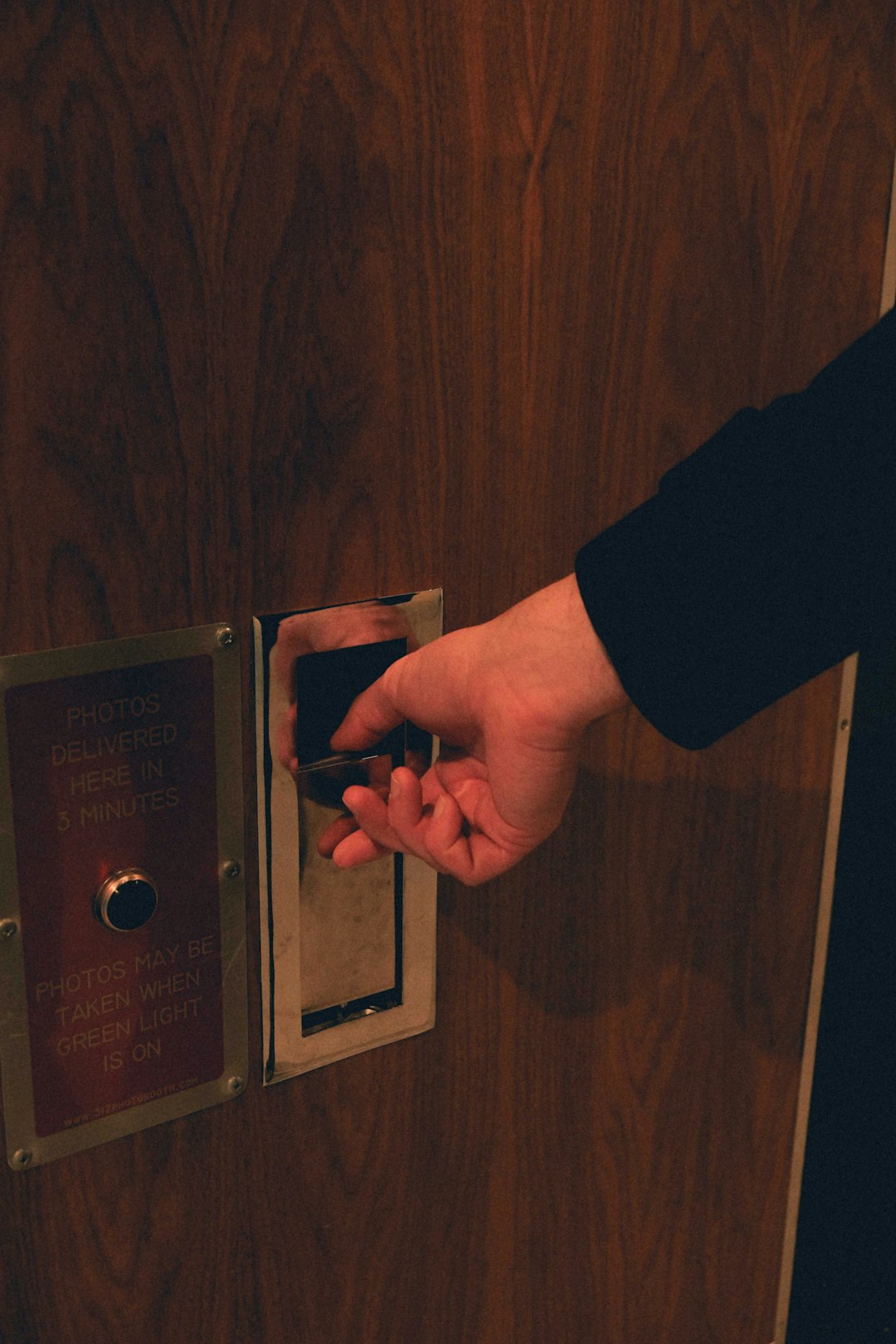 Hand using a digital access control keypad on a door